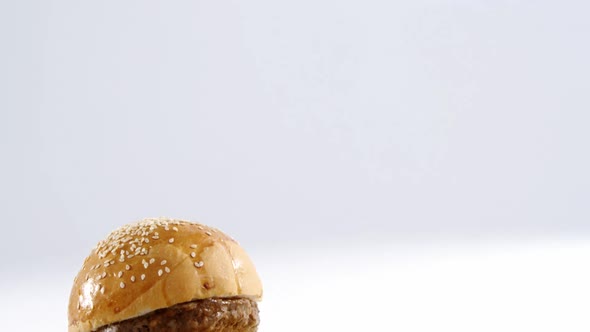 Snacks with ketchup on wooden board alt