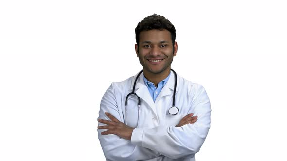 Happy Young Doctor Crossed Arms on White Background alt