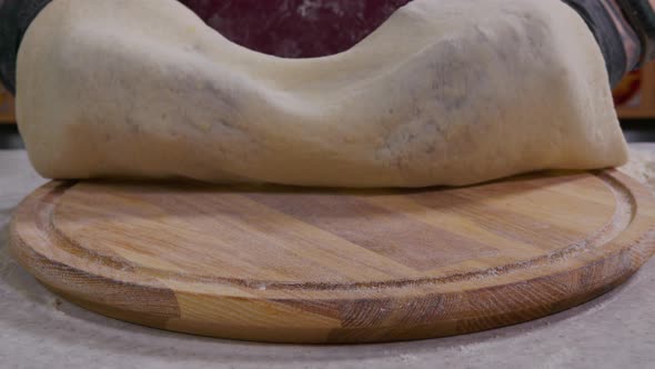 Close Up View of a Man Chef Cooking Italian Pizza. The Process of Making Pizza at Table . Fresh alt