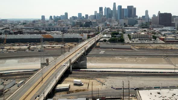 Aerial Famous 1st street bridge, Los Angeles skyline and skyscrapers of downtown, urban scene alt