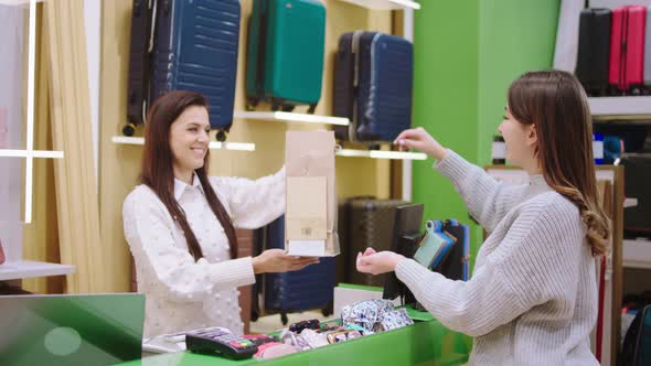 Happy Saleswoman in the Accessories Store at the alt
