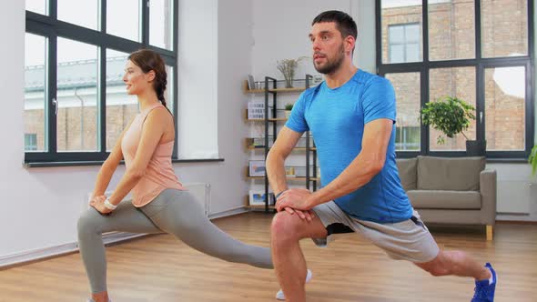 Couple Exercising and Doing Lunge at Home alt
