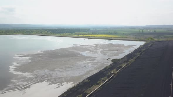 Aerial Video of an Ash Dump. The Pipeline From Which the Products of Coal Combustion Are Discharged