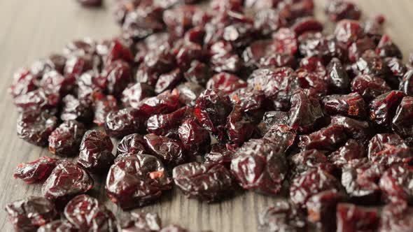 Close-up of sweet dehydrated cranberries on pile 4K 2160p 30fps UltraHD tilting footage - Heap of or alt