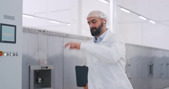 Charismatic Man Engineer with a Tablet in Hand alt