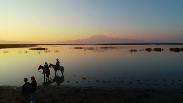 Cowboys With Horses and Couples at Sunrise alt