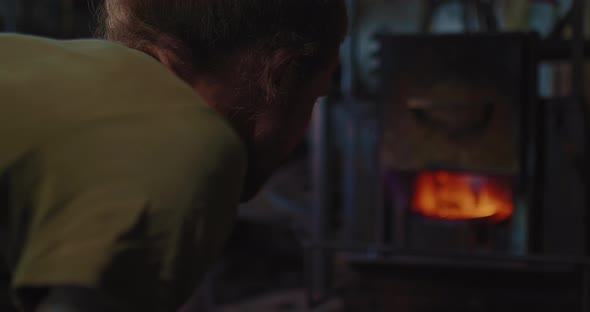 Blacksmith is Controlling Billet Heating Process in Forge Furnace Moving Focus  Prores alt