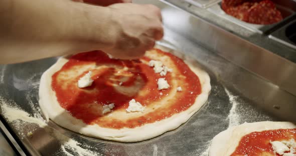 Preparing Pizza Margherita in the Kitchen in the Restaurant alt