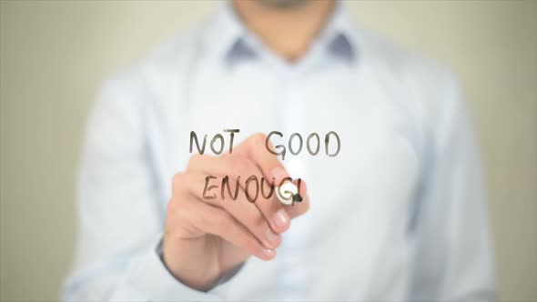 Not Good Enough Man Writing on Transparent Screen alt