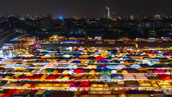 time lapse of Train Night Market Ratchada (Talad Rot Fai) at night in Bangkok, Thailand alt