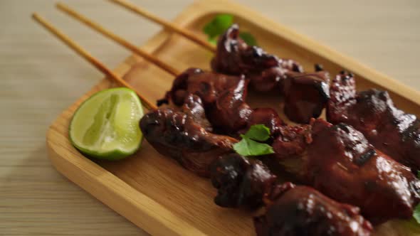 grilled chicken liver with herbs and spices on plate alt