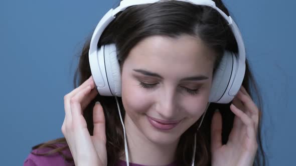 Girl with headphones listening to music