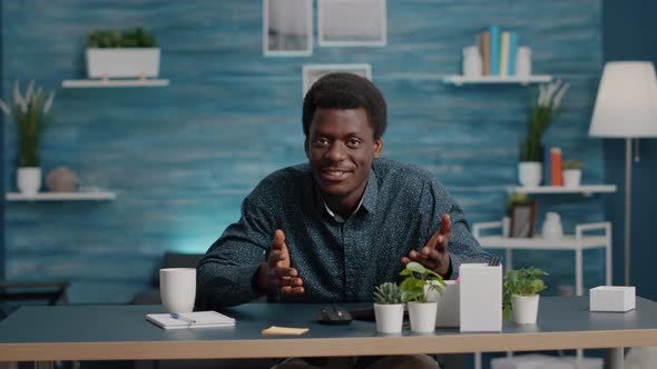 POV Black Man on Online Video Conference Call with Teammates Talking to the Camera alt