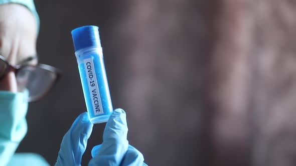 Doctor holding a recipient with the coronavirus COVID-19 vaccine