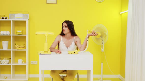 Young Woman Has Tense Phone Conversation alt