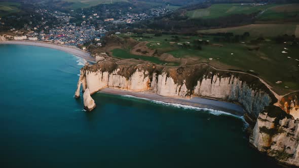 Drone Approaching Epic White Chalk Cliff Bay Coastline and Amazing Azure Sea Near Beautiful Town alt
