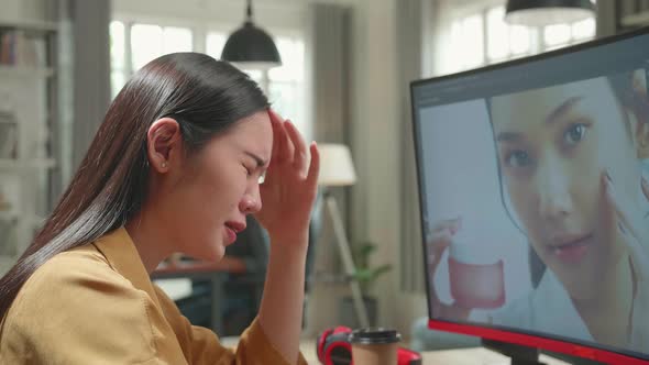 Tired Asian Female Digital Editor Works In Photo Editing Software On Her Personal Computer alt