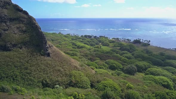 Aerial view of Ko'olau mountainside at Kualoa Kaneohe on a sunny day alt