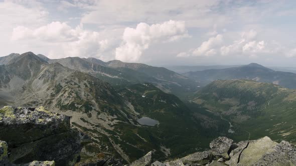 Panning shot showing panoramic view of the valley and Rohacske plesa lakes in West Tatras, Slovakia alt