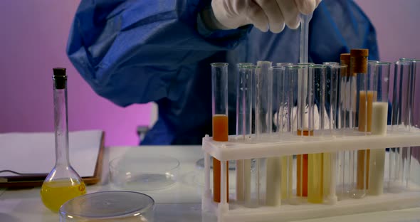 Close-up Lab Technician Mixes Jets in Pettree Cup To Get a Reaction alt