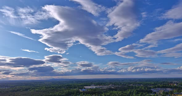 Dramatic White Clouds or Puffy Fluffy Cumulus Cloudscape Slowly Moved Over the Small American Inman alt