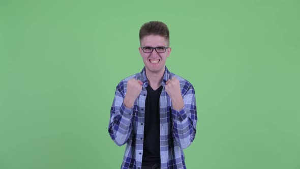 Happy Young Handsome Hipster Man Getting Good News alt