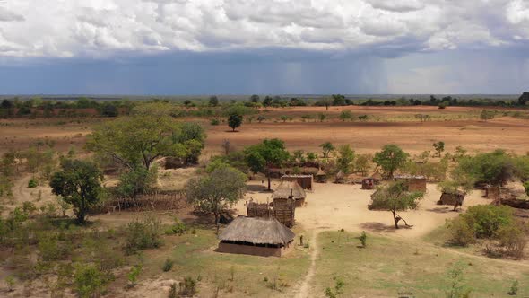 A remote African village with homes made from mud and grass. Zambia, Africa. 4K alt