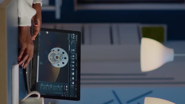 African Woman Engineer Working in Modern Cad Program with Gear alt