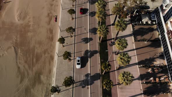 Close Up Top Down View Over Roads with Palm Trees and Few Vehicles alt