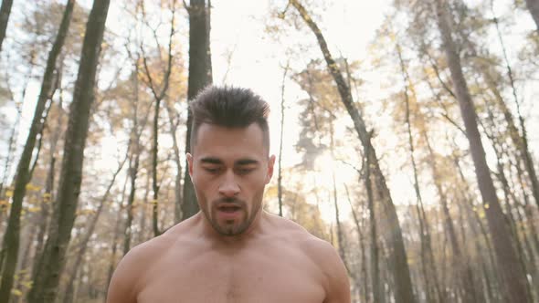 Athlete Jogging In The Forest. alt