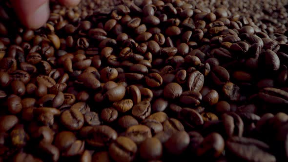 Man Hand Running Coffee Grains Close Up alt