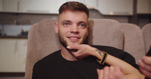 The Guy And The Girl Gently Caress Each Other And Watch Tv alt