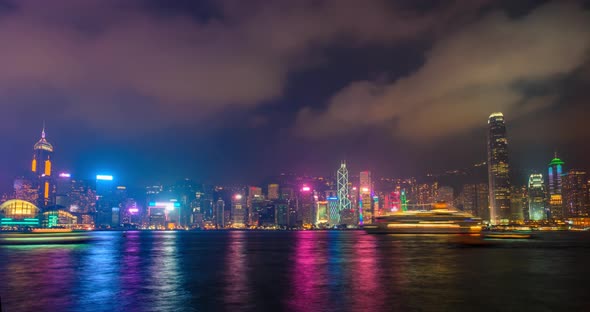 Night Imelapse of Illuminated Hong Kong Skyline. Hong Kong, China alt