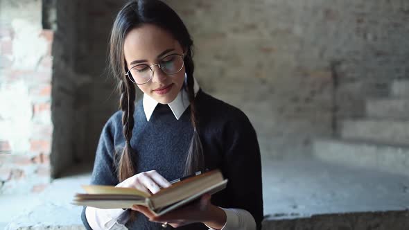 Young Female Student Reading Book alt