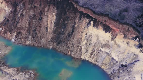 A Wonderful Azure Lake with Blue Water in the Clay Quarry of a Natural Canyon alt