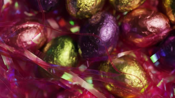 Rotating shot of colorful Easter candies on a bed of easter grass  alt