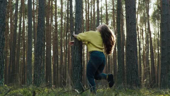 Beautiful Girl in the Forest with Long Hair Smiling alt