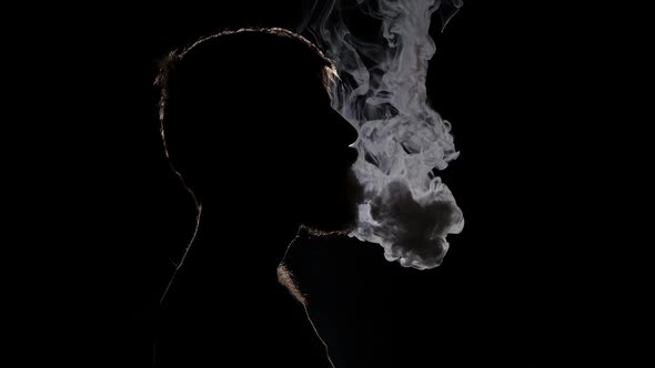 Man Smoking Electronic Cigarette Breathing Out Smoke, Black, Silhouette ...