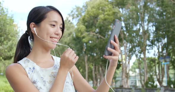 Woman having video call on cellphone  alt