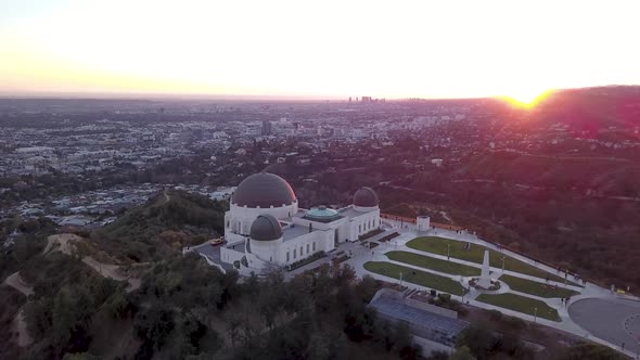 Aerial orbit of the famous historic Griffith Observatory landmark in Los Angeles California. alt