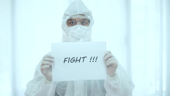 The doctor in PPE suit show text fight for Covid-19 Corona virus 