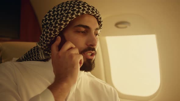 Professional Man Discussing Cell Phone Closeup alt