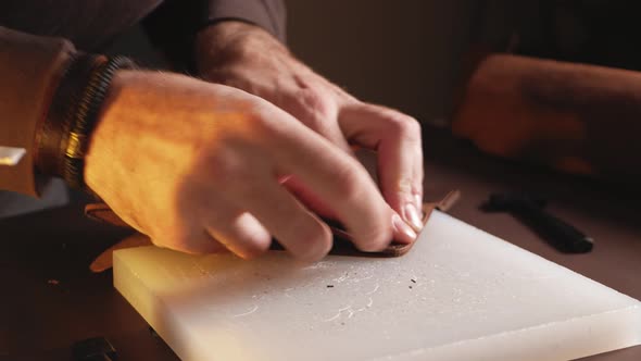 Tanner Works with Leather Makes Purse Manual Labor Small Business Production alt