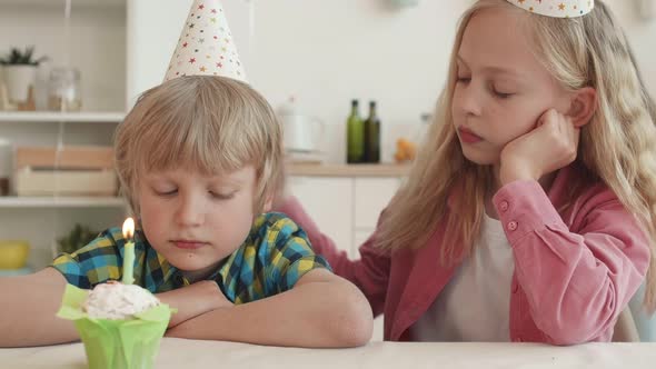 Sister Comforting Brother on Birthday alt