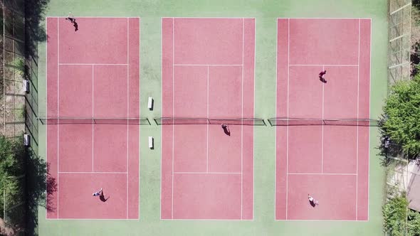 Tennis Players During Match on Court in Summer