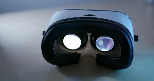 Virtual reality device playing video inside with red light at the back alt