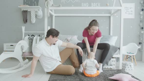 Cute Infant Getting Up From Carpet at Home alt