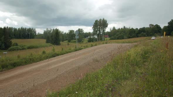 Rally Car Jump on Dirt Road alt