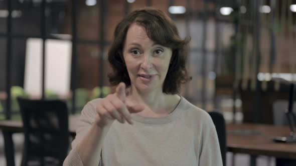 Ambitious Old Woman Pointing with Finger and Inviting alt