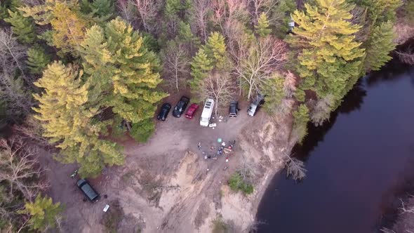 People On Overland Camping Adventure By The River Of Meskugon With Vehicles On Remote Forest Of Leot alt